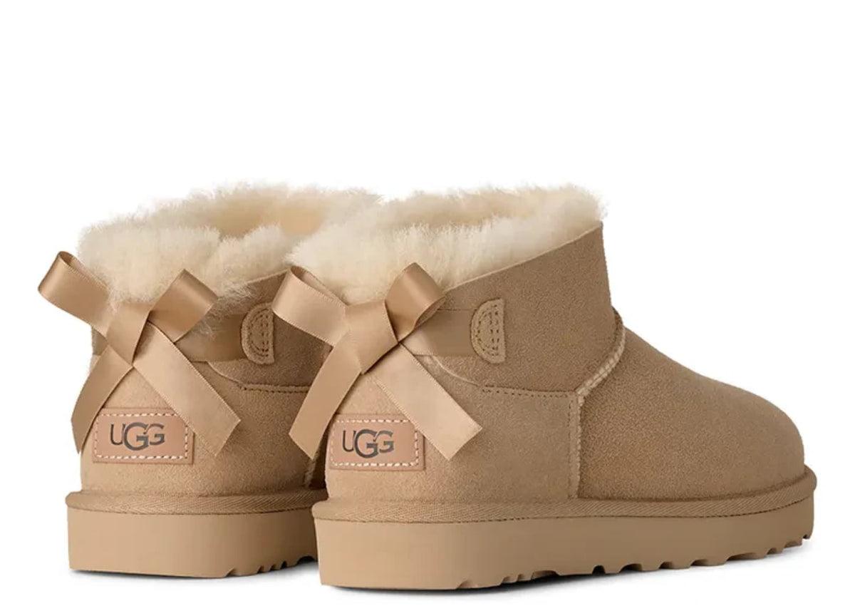 UGG Ultra Mini Bailey Bow Boot Sand (Women's)